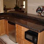 Granite tile wet bar and maple cabinets